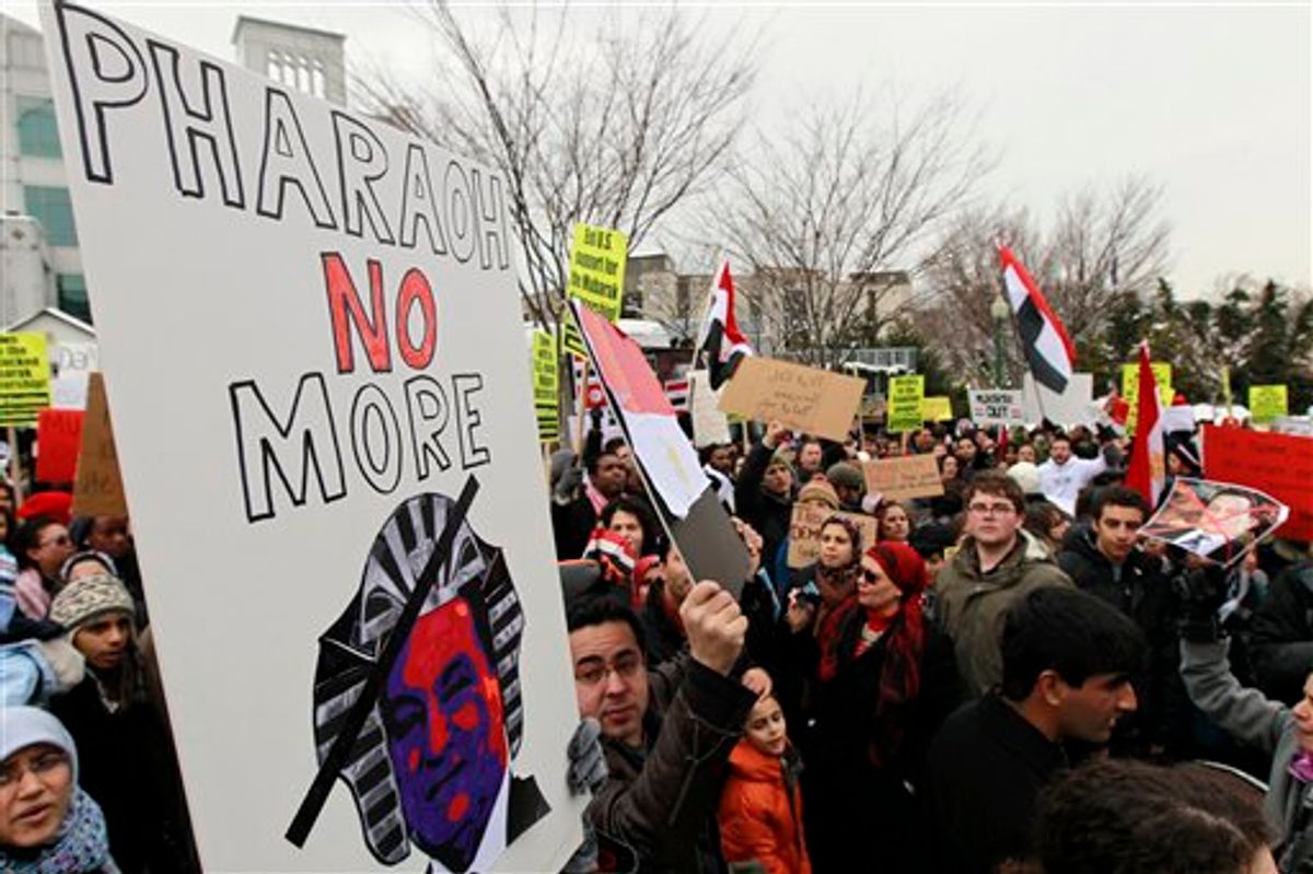 Demonstrators, holding signs and chanting, fill the street in front of the Egyptian embassy in Washington Saturday, Jan. 29, 2011, demanding that Egyptian President Hosni Mubarak step down. The demonstrators also criticizing the Obama administration's response to the clashes in Egypt.  (AP Photo/Alex Brandon) (AP)