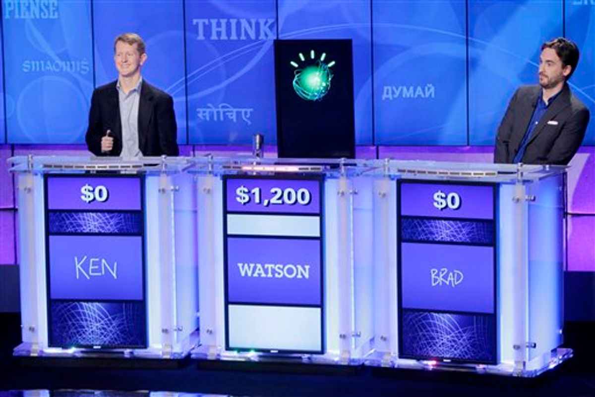 "Jeopardy!" champions Ken Jennings, left, and Brad Rutter, right, look on as an IBM computer called "Watson" beats them to the buzzer to answer a question during a practice round of the "Jeopardy!" quiz show in Yorktown Heights, N.Y., Thursday, Jan. 13, 2011. It's the size of 10 refrigerators, and it swallows encyclopedias whole, but an IBM computer was lacking one thing it needed to battle the greatest champions from the "Jeopardy!" quiz TV show - it couldn't hit a buzzer. But that's been fixed, and on Thursday the hardware and software system named Watson played a competitive practice round against two champions. A "Jeopardy!" show featuring the computer will air in mid-February, 2011. (AP Photo/Seth Wenig) (AP)