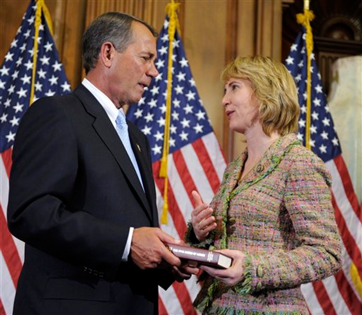 FILE - In a Jan. 5, 2011 file photo, House Speaker John Boehner of Ohio reenacts the swearing in of Rep. Gabrielle Giffords, D-Ariz., on Capitol Hill in Washington. She loves motorcycles and yoga, and is as comfortable in a business suit walking the halls of Congress as she is clad in leather riding gear at the famed Sturgis Motorcycle Rally. She holds a master's degree in urban planning, yet can mount a tire in a flash. Pretty and petite, sometimes soft-spoken, she will take on even her most ardent   adversaries and try talking them down with a firm hand but also a smile. Said one friend of Gabrielle Giffords: "She really pretty much defies a lot of description."  (AP Photo/Susan Walsh, File) (AP)