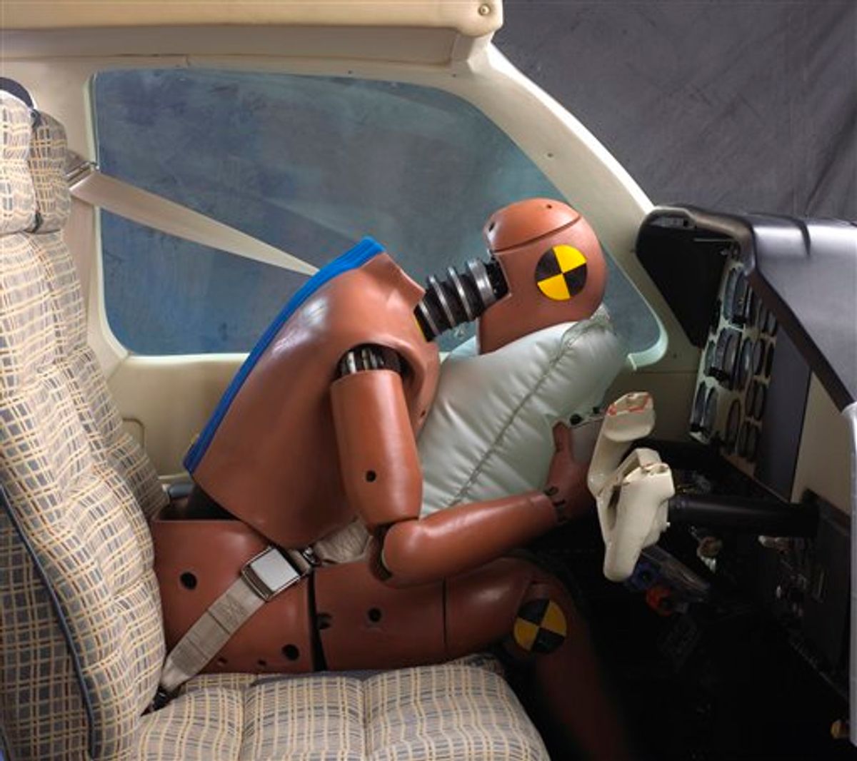 This image provided by AmSafe Inc., demonstrates an aviation airbag using a crash dummy. The airbags are located on the shoulder harness and deploy on impact. The National Transportation Safety Board is set to release a study on Tuesday, Jan. 11, 2011, of 138 accidents involving planes equipped with air bags. (AP Photo/AmSafe Inc.) (AP)