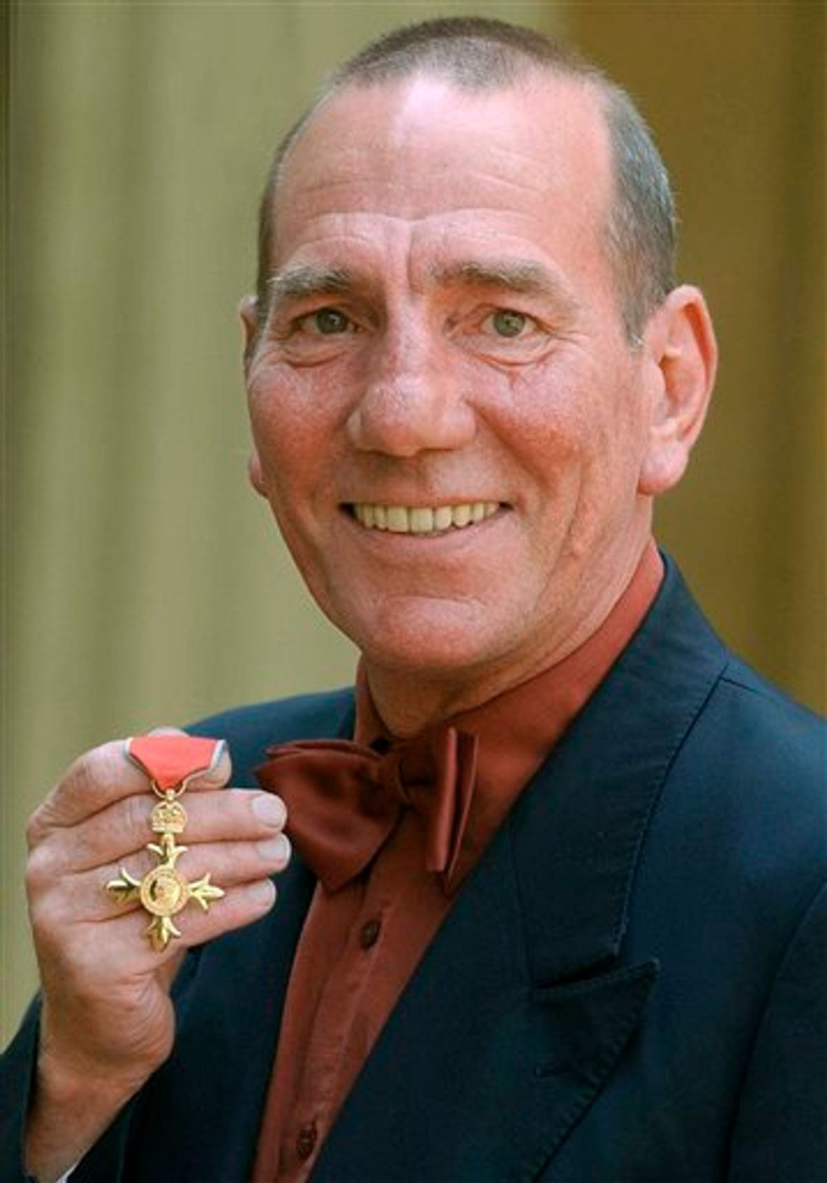 FILE -A Wednesday, June 9, 2004 photo from files showing  British actor Peter Postlethwaite displaying his Order of the British Empire or OBE, shortly after the presentation at Buckingham Palace in London.  Britain's Press Association is reporting Monday, Jan. 3, 2011 that decorated film actor Pete Postlethwaite has died at the age of 64. It quotes longtime friend Andrew Richardson as saying Monday that Postlethwaite died in hospital in Shropshire, central England, after a long illness. Richardson said Postlethwaite died Sunday. He had been receiving treatment for cancer.  (AP Photo /Kirsty Wigglesworth/ Pool) (AP)