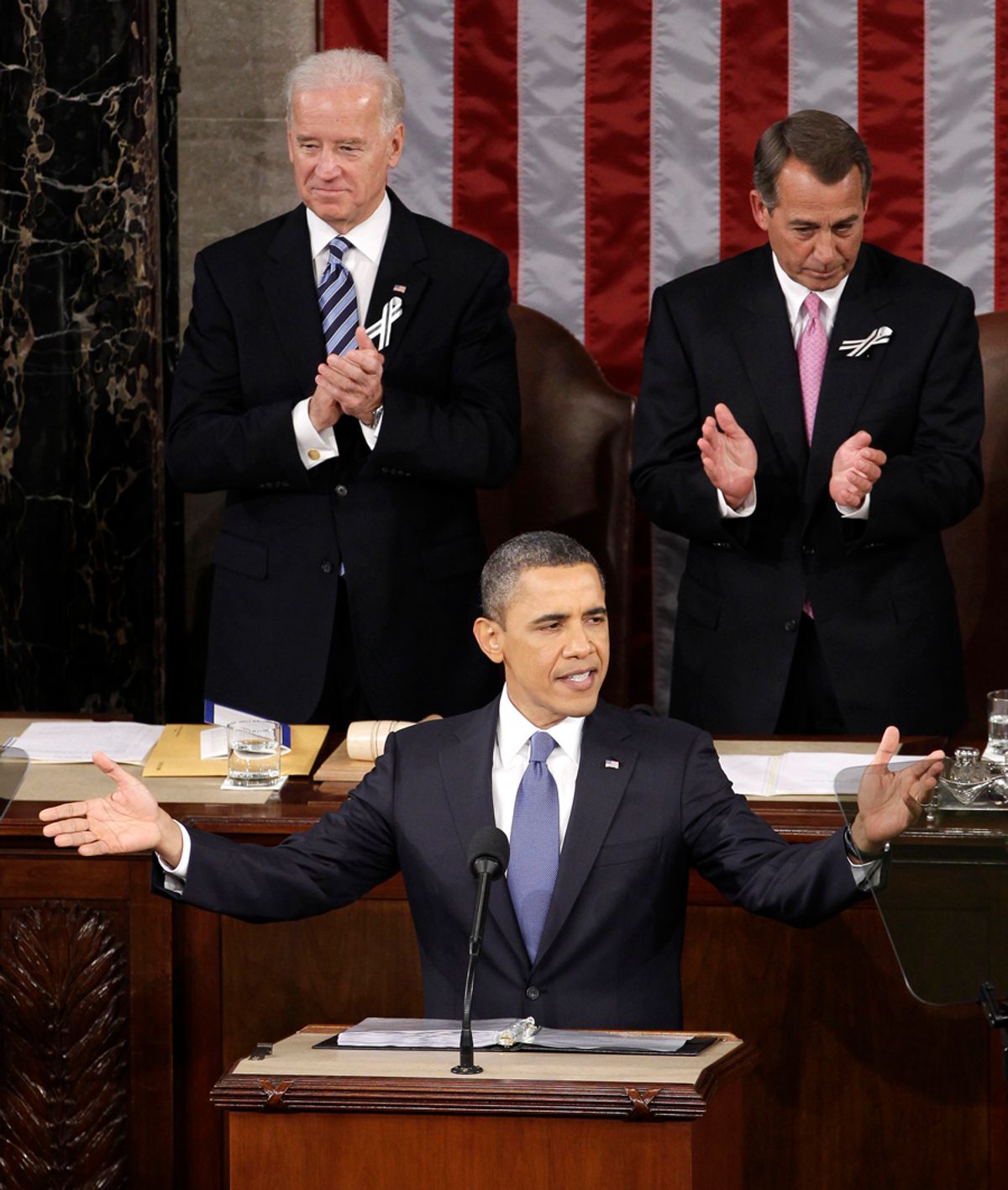 President Barack Obama gestures on Capitol Hill in Washington, Tuesday, Jan. 25, 2011, prior to delivering his State of the Union address in Washington, Tuesday, Jan. 25, 2011. Vice President Joe Biden and House Speaker John Boehner of Ohio applaud at rear. (AP Photo/Charles Dharapak) (Charles Dharapak)