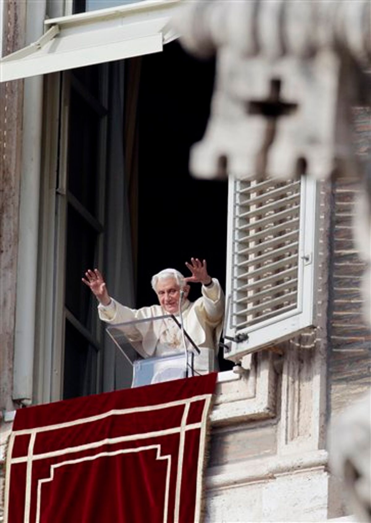 Pope Benedict XVI waves to faithful during the Angelus prayer in St. Peter's square at the Vatican, Sunday, Jan. 2, 2011. (AP Photo/Gregorio Borgia) (AP)