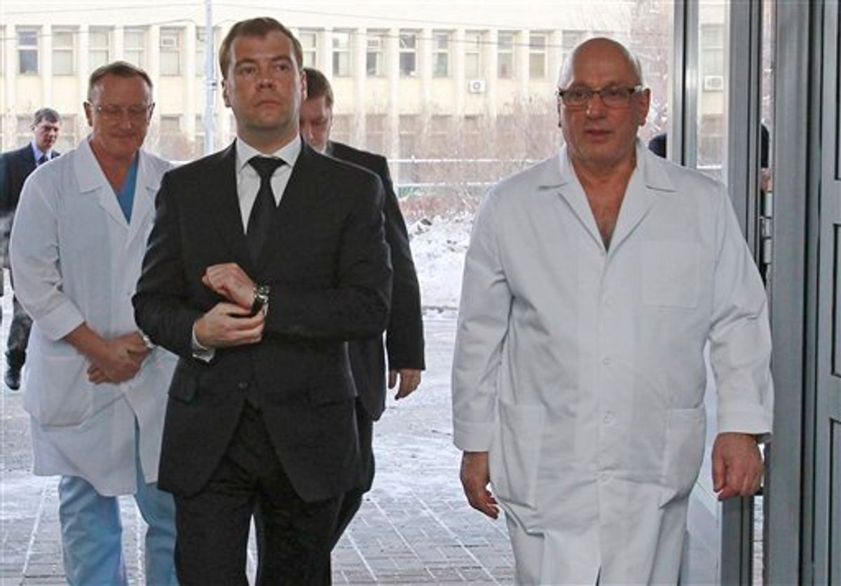 Russian Presiden Dmitry Medvedev, visits the Sklifosovsky emergency hospital where some people injured in a suicide bombing at Moscow's main airport on Monday are being treated, in Moscow, Tuesday, Jan. 25, 2011. At right is Director of the Sklifosovsky emergency hospital Anzor Khubuti,  (AP Photo/RIA Novosti, Vladimir Rodionov, Presidential Press Service) (AP)