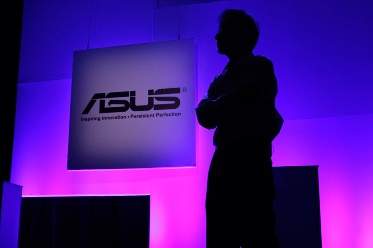 Asus International CEO Jonney Shih presents a demonstration of the company's newest tablets at a press event for the Consumer Electronics Show in Las Vegas. 