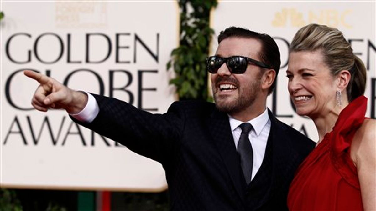 Ricky Gervais, left, arrives with his partner Jane Fallon for the Golden Globe Awards Sunday, Jan. 16, 2011, in Beverly Hills, Calif. (AP Photo/Matt Sayles) (AP)