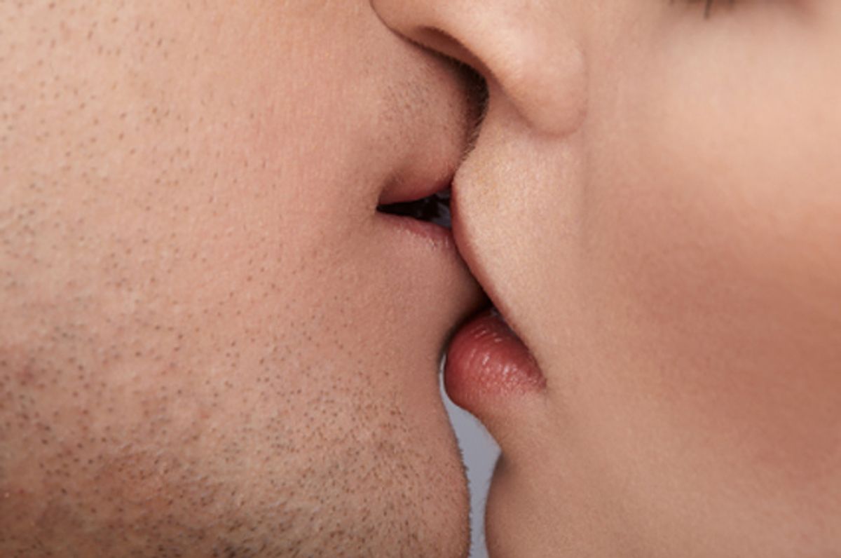 close up portrait of young caucasian couple kissing (Serg Zastavkin)