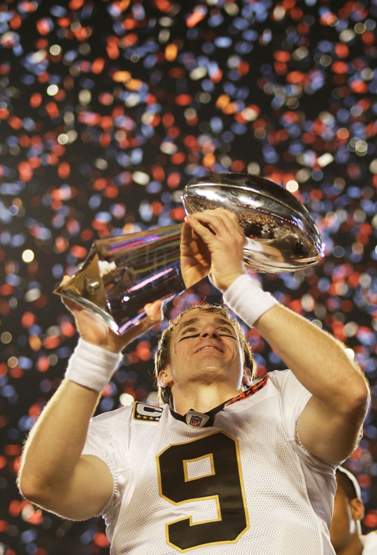 FILE - This Feb. 7, 2010, file photo shows New Orleans Saints quarterback Drew Brees holding the Vince Lombardi Trophy after the NFL Super Bowl XLIV football game against the Indianapolis Colts,  in Miami.  Brees was voted the 2010 Male Athlete of the Year, chosen by members of The Associated Press, Friday, Dec. 17, 2010. (AP Photo/David J. Phillip, File) (David J. Phillip)