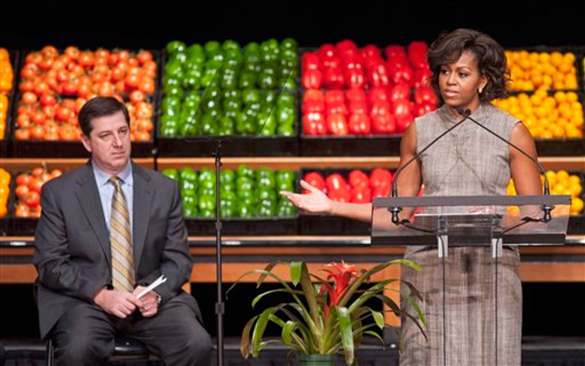 Wal-Mart President and CEO Bill Simon looks on as First lady Michelle Obama takes part in Wal-Mart's announcement of a comprehensive effort to provide healthier and more affordable food choices to their customers, Thursday, Jan. 20, 2011, in Washington. (AP Photo/Cliff Owen) (AP)