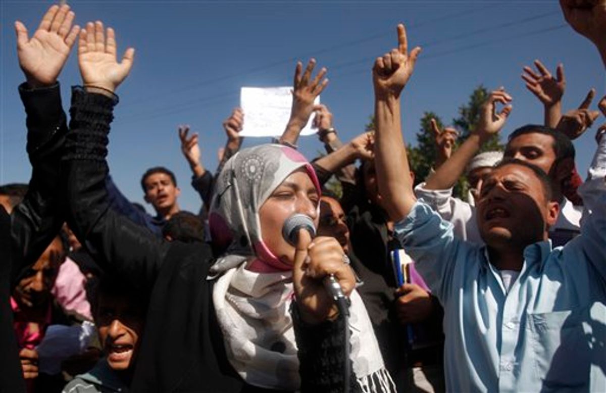 Yemeni students chant slogans calling on their president Ali Abdullah Saleh to leave the government and follow Tunisian ousted President Zine El Abidine Ben Ali into exile during a protest in Sanaa, Yemen, Saturday, Jan. 22, 2011.  (AP Photo/Hani Mohammed)  (AP)