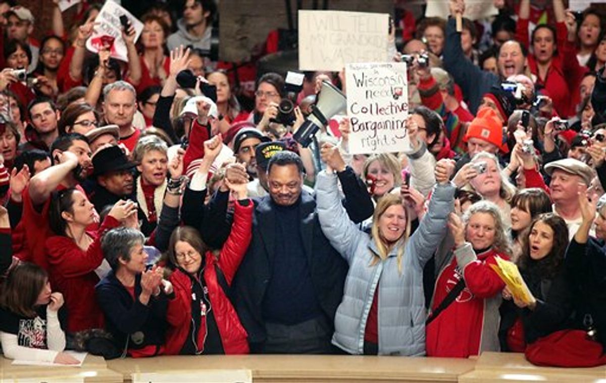 Jesse Jackson stands with protesters at the Capitol rotunda in Madison, Wis. on Friday, Feb.  17, 2011.  Union members, students and others have been protesting the governor's bill to eliminate collective bargaining rights for many state workers.  (AP Photo/Wisconsin State Journal, Craig Schreiner) (AP)