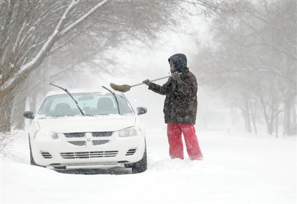 Marques Lewis sweeps snow from his car, Tuesday, Feb. 8, 2011, in Salina, Kan. Lewis said he was "getting ready to go to work" and had to "start a little early." Three to four inches had fallen in the Salina area by mid-morning with the temperature at five degrees. (AP Photo/Salina Journal, Tom Dorsey) (AP)