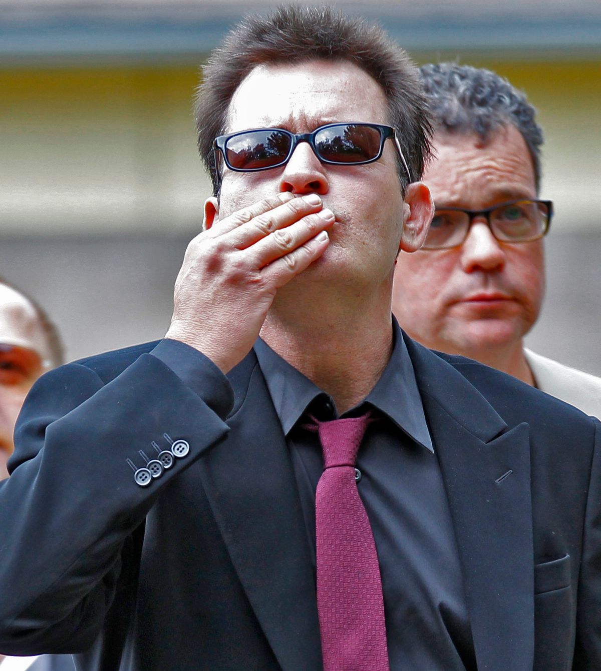 Charlie Sheen gestures with a victory sign as he arrives at the Pitkin County Courthouse in Aspen, Colo., on Monday, Aug 2, 2010, for a hearing in his domestic abuse case. (AP Photo/Ed Andrieski (Ed Andrieski)