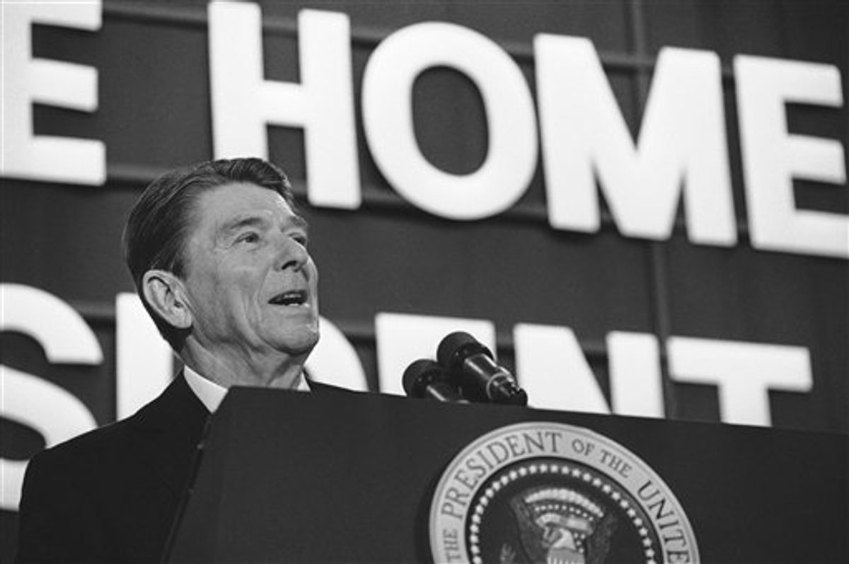 FILE - In this Feb. 7, 1984 file photo, President Ronald Reagan addresses a crowd of well-wishers gathered for a huge birthday party in the Dixon High School gymnasium in Dixon, Ill. Reagan returned to his boyhood home for the first time since becoming president to celebrate his 73rd birthday. Reagan was born 100 years ago Sunday, Feb. 6, 2011. (AP Photo/Dennis Cook, File) (AP)