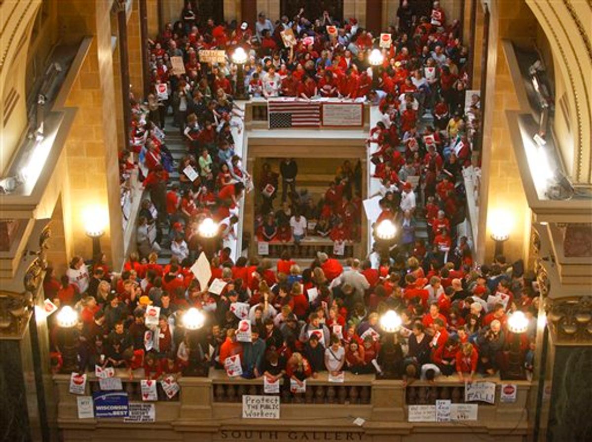 Protestors to Wisconsin Gov. Scott Walker's bill to eliminate collective bargaining rights for many state workers pack the rotunda at the State Capitol in Madison, Wis., Thursday, Feb. 17, 2011. (AP Photo/Andy Manis) (AP)