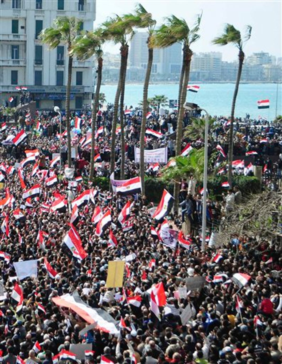 Thousands of Egyptian anti-government protesters march Alexandria, Egypt, Friday, Feb. 11, 2011. Egypt's military threw its weight Friday behind President Hosni Mubarak's plan to stay in office through September elections while protesters fanned out to the presidential palace in Cairo and other key symbols of the authoritarian regime in a new push to force the leader to step down immediately. The statement by the Armed Forces Supreme Council - its second in two days - was a blow to many protesters who had called on the military to take action to push out Mubarak after his latest refusal to step down. (AP Photo/ Tarek Fawzy) (AP)