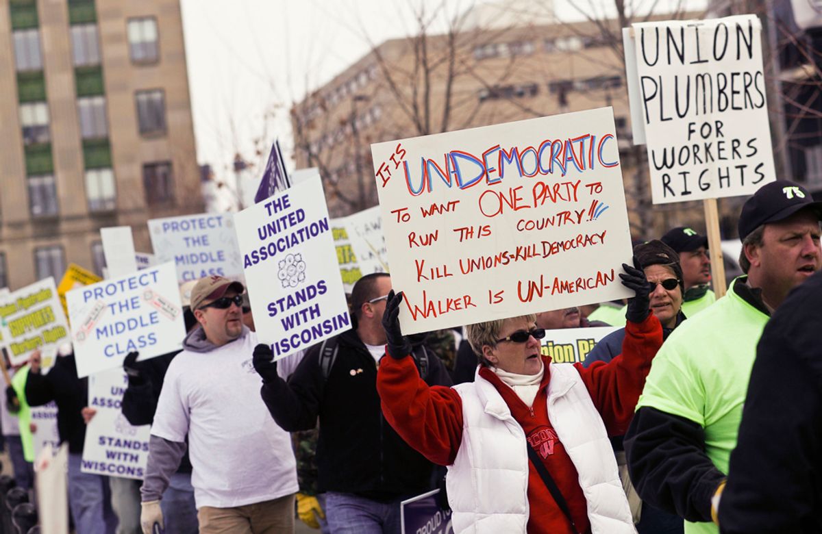 Protesters march around the Capitol Square in Madison, Wis., Friday, Feb. 25, 2011, over the governor's proposed budget. Protests to the governor's bill to eliminate collective bargaining rights for many state workers are in their 11th day. (AP Photo/Andy Manis) (Andy Manis)