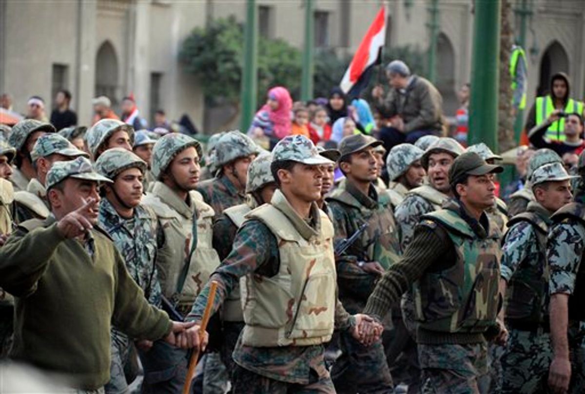 Egyptian army soldiers inside Tahrir Square, Egypt, Saturday, Feb. 12, 2011. The main coalition of youth and opposition groups says it will end its protest in a central Cairo square after they succeeded in ousting longtime authoritarian leader Hosni Mubarak. But the groups say they will call for weekly demonstrations to maintain pressure on the ruling military to implement democratic reforms. (AP Photo/Amr Nabil) (AP)