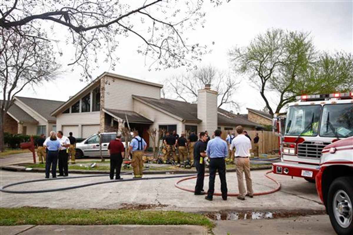 Emergency Personnel respond to the location where a fire broke out at a day care operated by Jessica Tata, 22,  lkilling three children and injuring four others Thursday, Feb. 24, 2011, in Houston. (AP Photo/Houston Chronicle, Michael Paulsen) MANDATORY CREDIT (AP)
