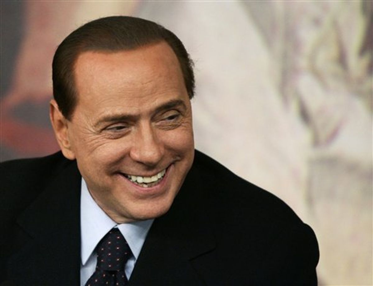 Italian Premier Silvio Berlusconi smiles during a press conference at Chigi Premier's palace, in Rome, Wednesday, Feb. 16, 2011. Berlusconi says he is not worried by an impending prostitution trial, in his first public comments since he was indicted. The 74-year-old Italian leader was ordered Tuesday to stand trial on charges he paid a 17-year-old Moroccan girl for sex, and then used his influence to cover it up. (AP Photo/Riccardo De Luca)        (AP)