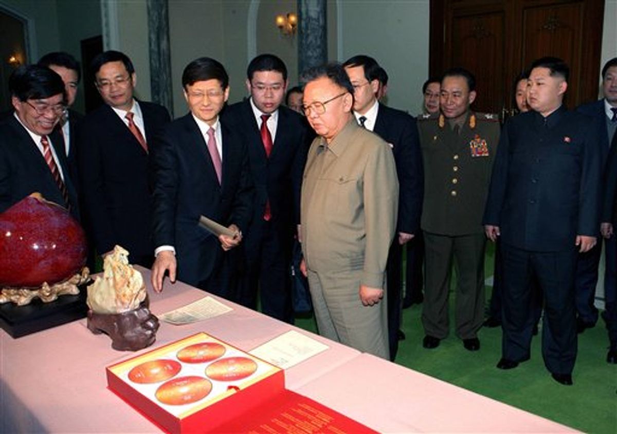 In this photo released by Korean Central News Agency via Korea News Service in Tokyo Tuesday, Feb. 15, 2011, North Korean leader Kim Jong Il, center right, looks at the gifts brought by visiting Chinese Minister of Public Security Meng Jianzhu, fourth left, in Pyongyang, North Korea, on Monday, Feb. 14, 2011. At right is Kim's son Kim Jong Un. (AP Photo/Korean Central News Agency via Korea News Service) JAPAN OUT                      (AP)