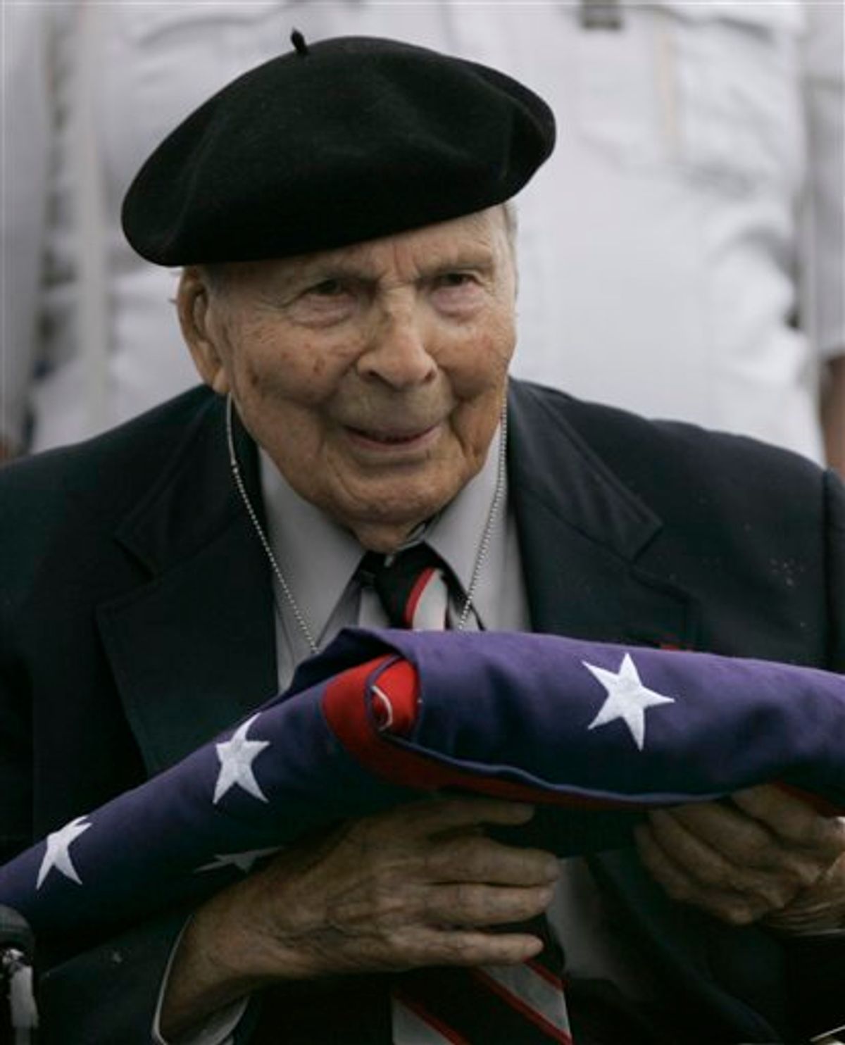 FILE -- In a May 26, 2008 file photo Frank Buckles receives an American flag during Memorial Day activities at the National World War I Museum in Kansas City, Mo. Biographer and family spokesman David DeJonge said in a statement that Frank Woodruff Buckles died early Sunday, Feb. 27, 2011 of natural causes in his home in Charles Town, W.Va.   (AP Photo/Charlie Riedel) (AP)
