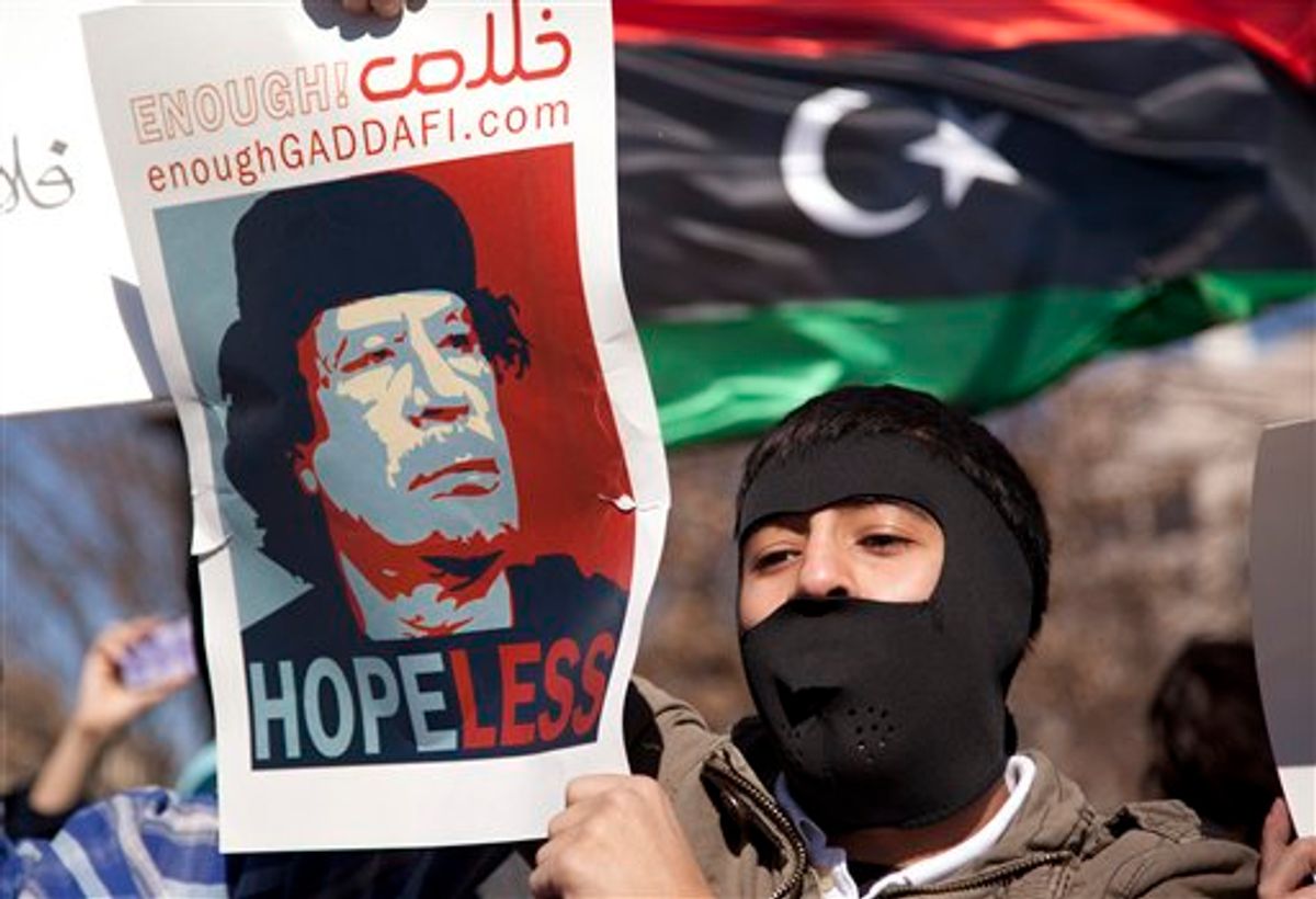 Demonstrators gather near the White House in Washington in a show of solidarity with the Libyan protestors on Saturday, Feb. 19, 2011.  Moammar Gadhafi's forces fired on mourners leaving a funeral for protesters Saturday in the eastern city of Benghazi, killing at least 15 people and wounding scores more as the regime tried to squelch calls for an end to the ruler's 42-year grip on power.  (AP Photo/Evan Vucci) (AP)