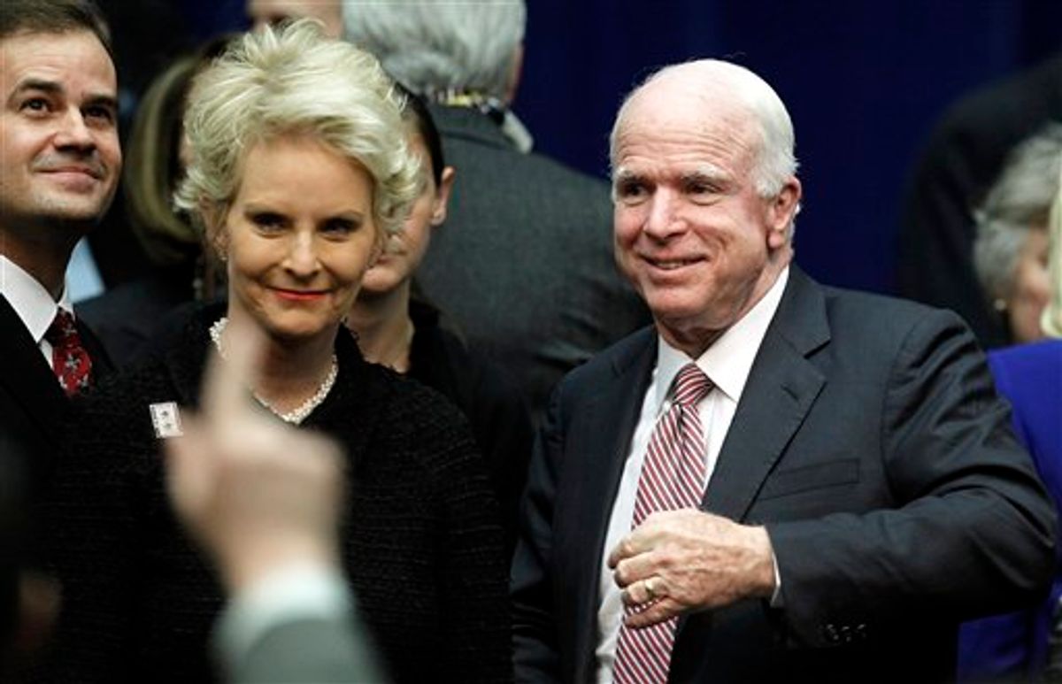 Sen. John McCain, R-Ariz., and wife Cindy arrive at a memorial service for the victims of Saturday's shootings at McKale Center on the University of Arizona campus Wednesday, Jan. 12, 2011, in Tucson, Ariz. (AP Photo/Chris Carlson) (AP)