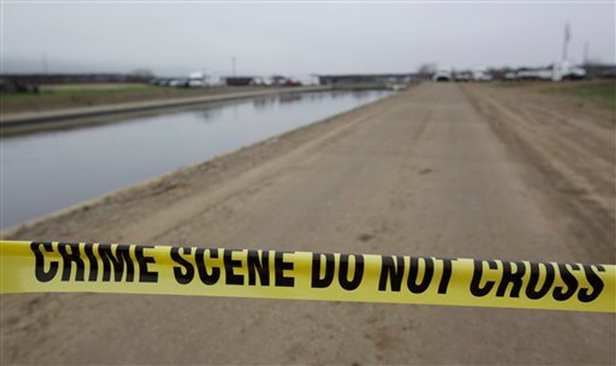 Crime scene tape is shown at a canal in Patterson, Calif., Friday, Jan. 28, 2011. The Toyota Corolla belonging to Jose Rodriguez, who is suspected of kidnapping 4-year-old Juliani Cardenas, was pulled up from the canal.  (AP Photo/Paul Sakuma) (AP)