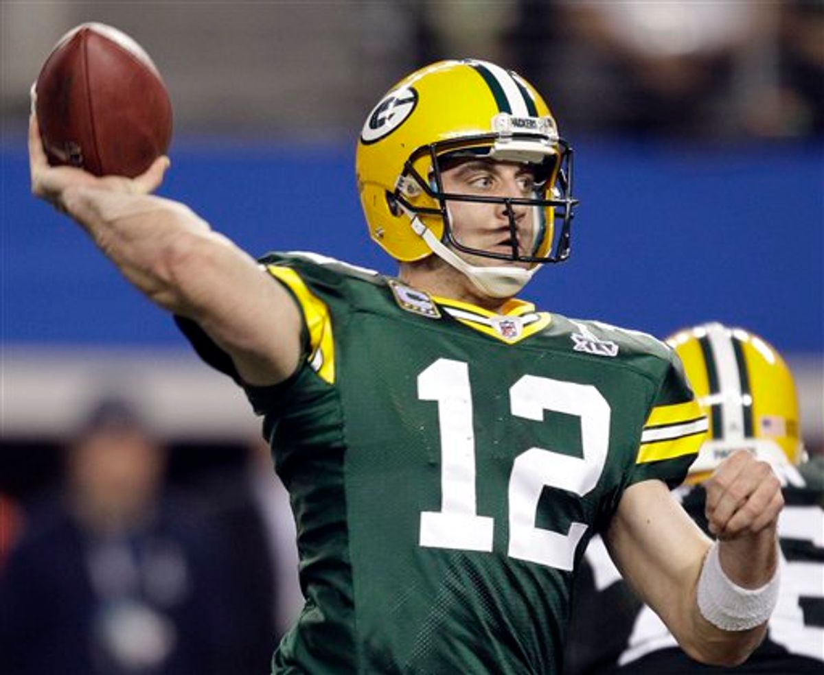 Green Bay Packers' Aaron Rodgers throws a touchdown pass during the second half of the NFL football Super Bowl XLV game against the Pittsburgh Steelers Sunday, Feb. 6, 2011, in Arlington, Texas. (AP Photo/Chris O'Meara) (AP)