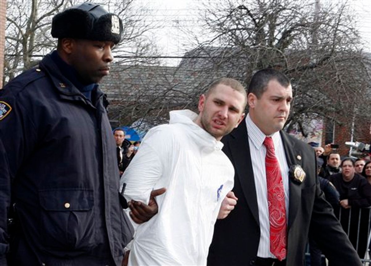 Maksim Gelman, of Brooklyn, who is accused of going on a 28-hour stabbing rampage through New York City, center, is lead by officers outside the 61st Precinct in the Brooklyn borough of New York Sunday, Feb. 13, 2011. (AP Photo/David Karp) (AP)