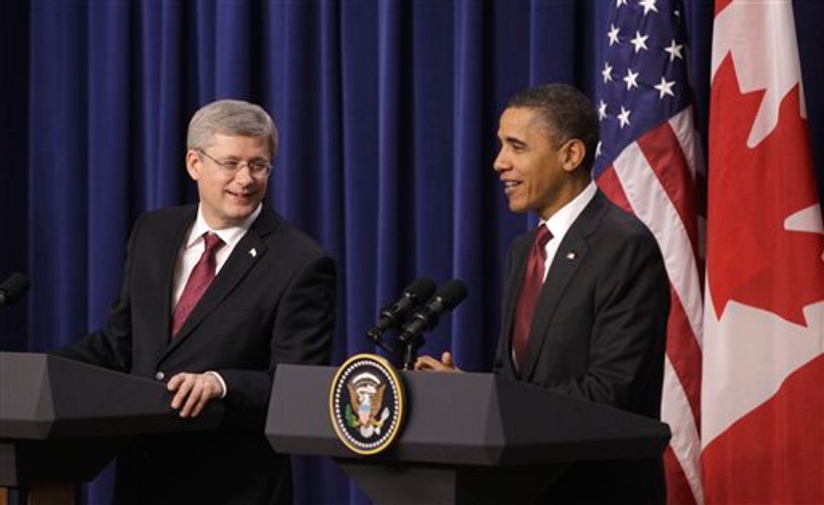 President Barack Obama and Canada's Prime Minister Stephen Harper take part in a joint news conference, Friday, Feb. 4, 2011, in the Eisenhower Executive Office Building on the White House complex in Washington. (AP Photo/Charles Dharapak) (AP)