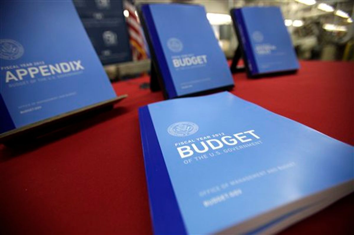 In this photo taken Feb. 10, 2011, the 2012 budget is on display at the U.S. Government Printing Office at Washington. President Barack Obama Obama will send his 2012 budget proposal to Congress on Monday, Feb. 14.  According to an Office of Management and Budget summary obtained by The Associated Press, the administration will propose more than $1 trillion in deficit reduction over the next decade with two-thirds of that amount coming from spending cuts.  (AP Photo/Jacquelyn Martin) (AP)