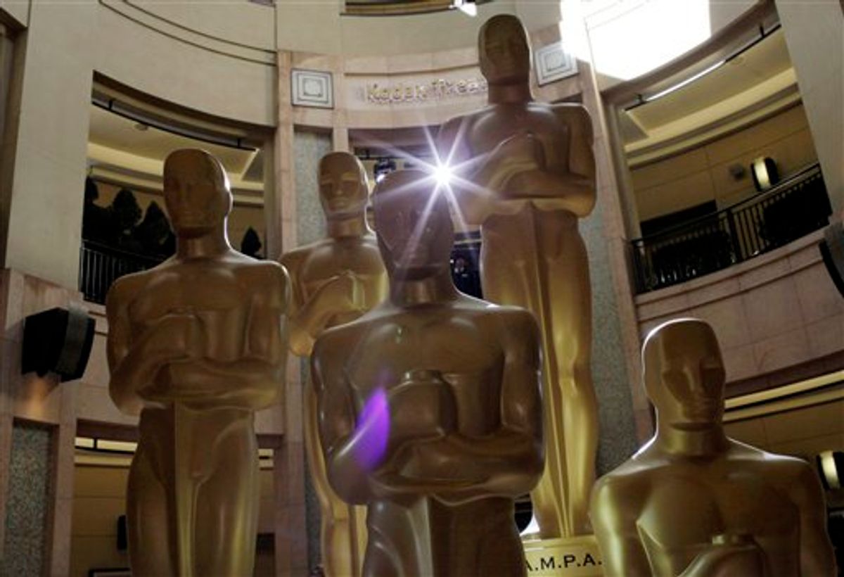 Oscar statues stand in front of the Kodak Theatre as preparations for the 83rd Academy Awards continue in Los Angeles, Saturday, Feb. 26, 2011. (AP Photo/Jae C. Hong) (AP)