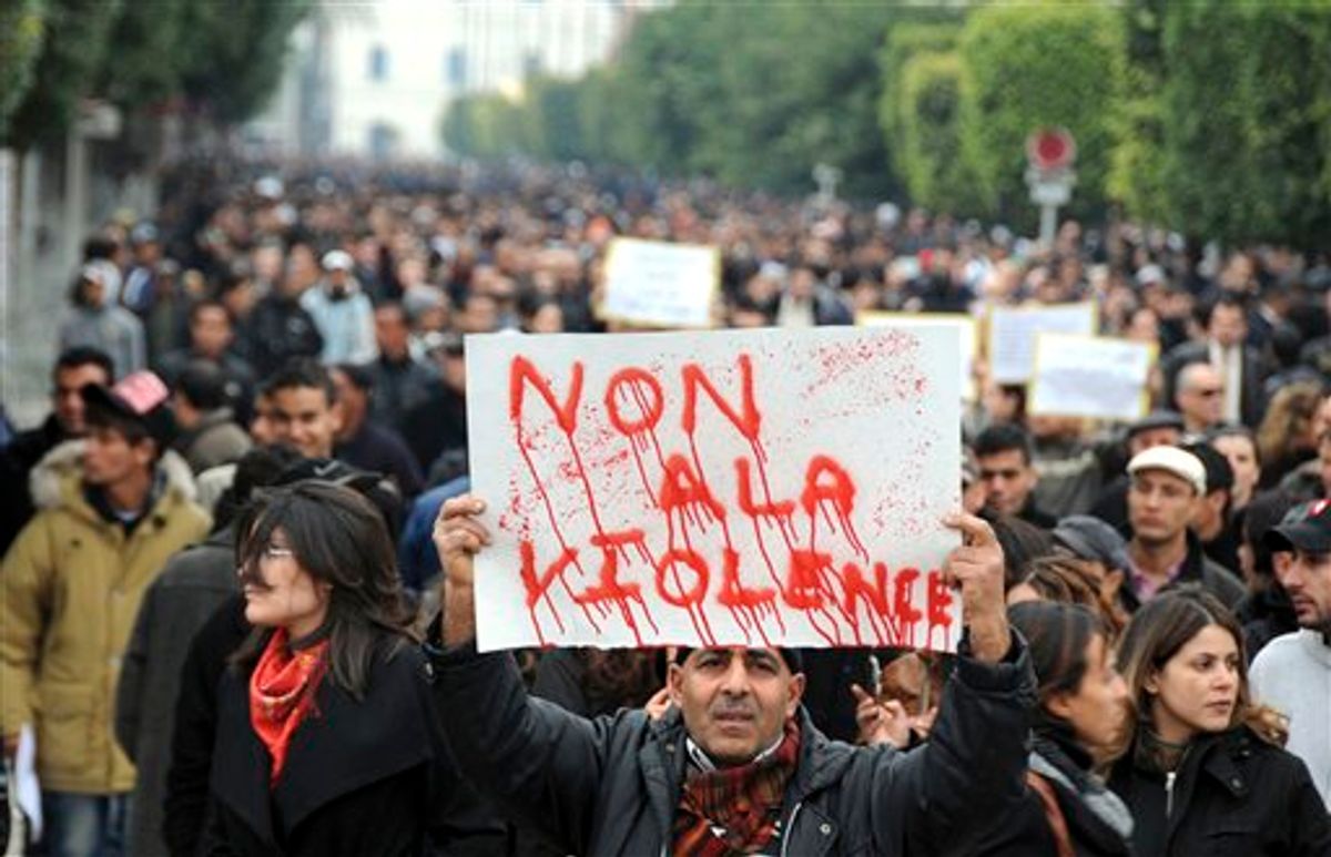 Protestors supporting the government and opposed to strikes demonstrate in Tunis, Tuesday Jan. 25, 2011. Tunisia's so-called "Jasmine Revolution" has sparked scattered protests and civil disobedience in the Middle East and North Africa, and much of the world is watching to see how the birth pangs of Tunisian democracy play out. Poster reads: No to the violence. (AP Photo/Hassene Dridi)  (AP)