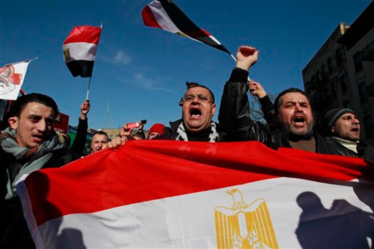 People celebrate after Egypt's President Hosni Mubarak resigned from office Friday, Feb. 11, 2011 in the Queens borough of New York. Mubarak resigned as president after 29 years in power. (AP Photo/Frank Franklin II) (AP)