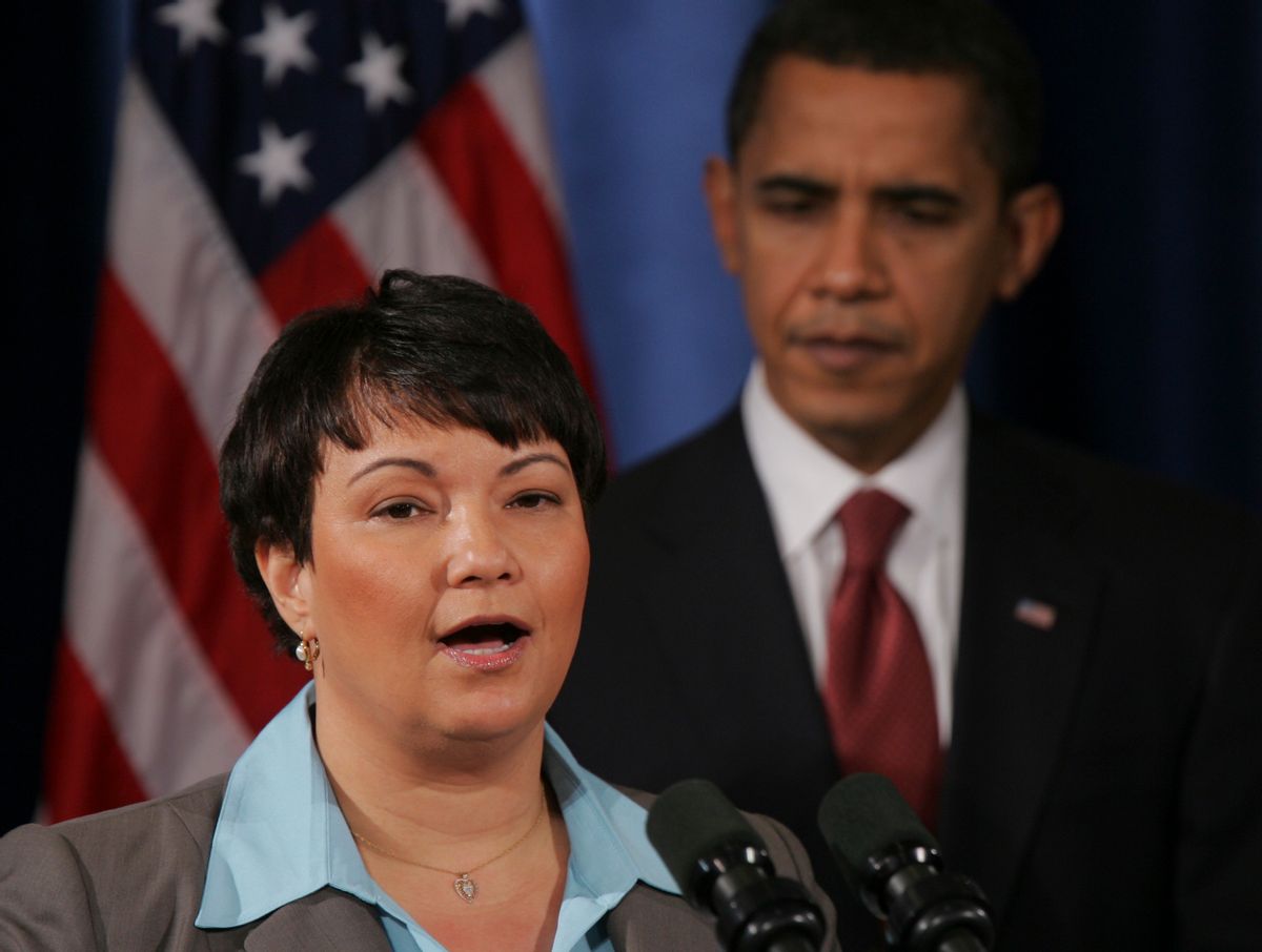 President-elect Barack Obama, right, listens EPA administrator nominee Lisa Jackson addresses the media at a news conference in Chicago, Monday, Dec. 15, 2008. (AP Photo) (Associated Press)