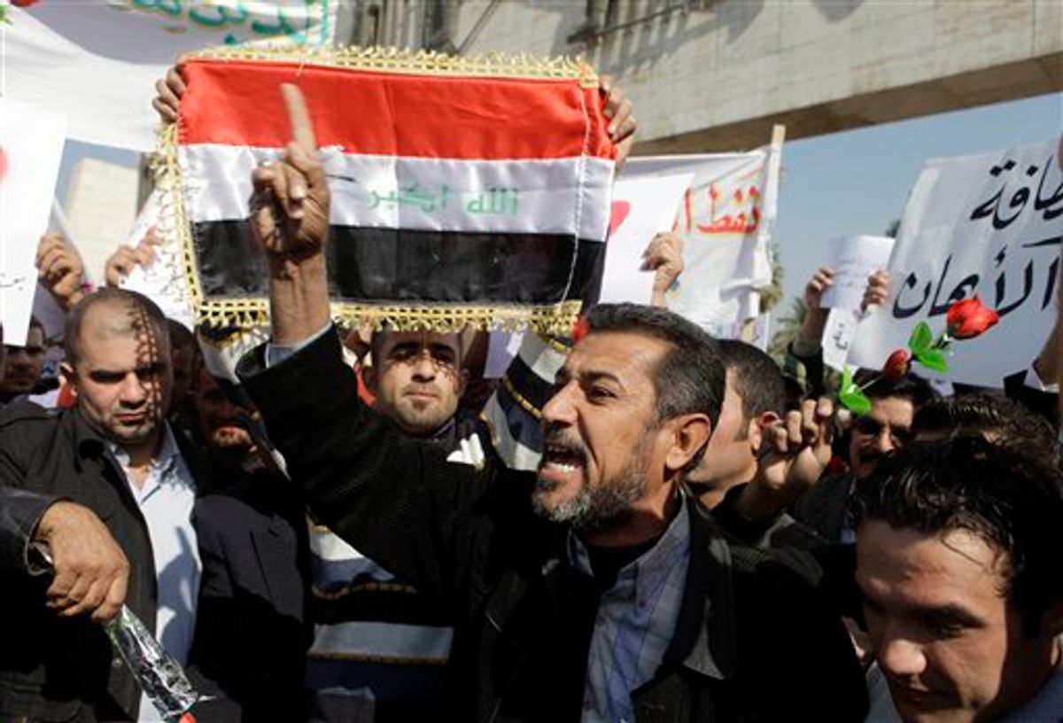 Protesters chant anti-government slogans during a demonstration in Baghdad, Iraq, Monday, Feb. 14, 2011. Hundreds of Iraqis rallied in central Baghdad against corruption and the lack of government services that have plagued this country for years.  (AP Photo/Karim Kadim) (AP)