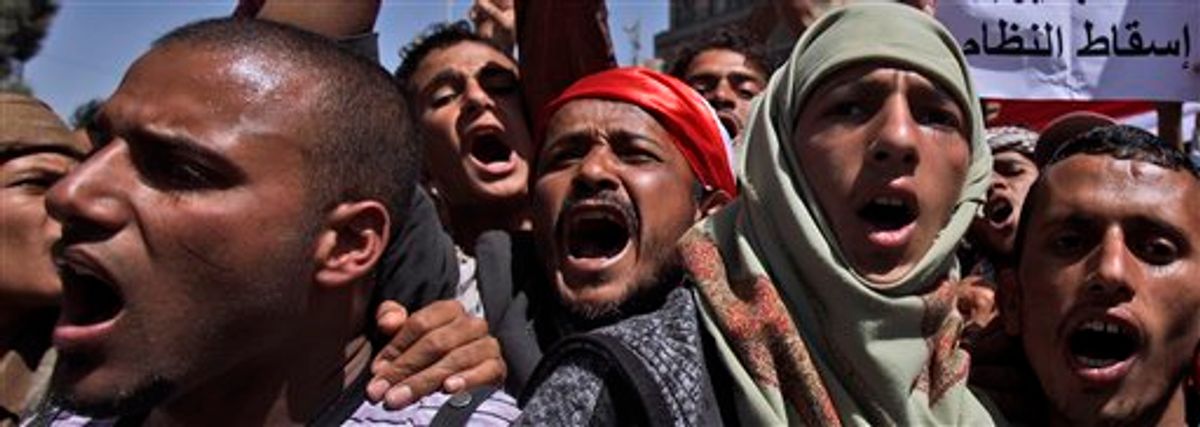 Anti-government protestors chant slogans during a demonstration demanding the resignation of Yemeni President Ali Abdullah Saleh, in Sanaa, Yemen, Thursday, Feb. 24, 2011. Yemen's president said Wednesday he had ordered his security services to protect protesters, stop all clashes and prevent direct confrontation between government supporters and opponents. (AP Photo/Muhammed Muheisen) (AP)