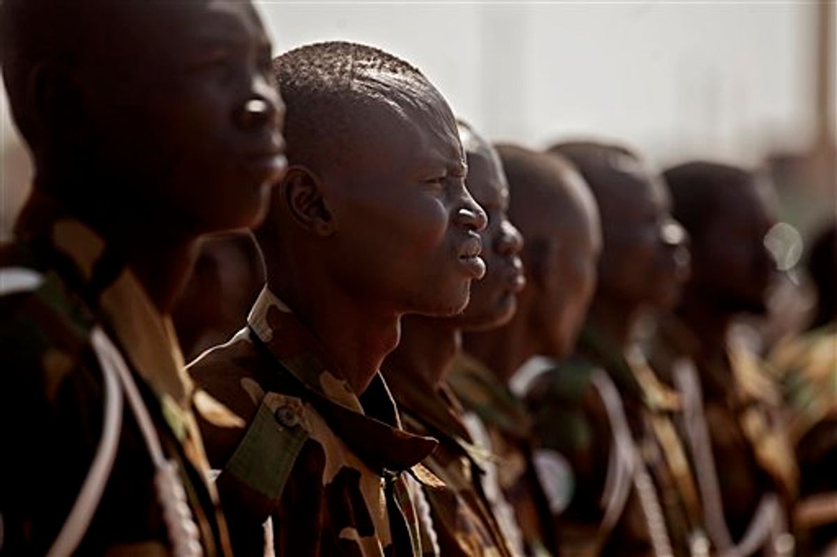 Southern Sudanese soldiers await the arrival of Malawi President Bingu wa Mutharika at the airport in the southern Sudanese capital of Juba on Wed. Jan. 26, 2011. Mutharika is the current chair of the African Union, a body that has been deeply engaged with southern Sudan up to and through its recent referendum on independence. Mutharika is the first head of state to visit southern Sudan since the referendum concluded on January 15, 2011. Preliminary results indicate that southerners voted heavily for independence. (AP Photo/Pete Muller)  (AP)