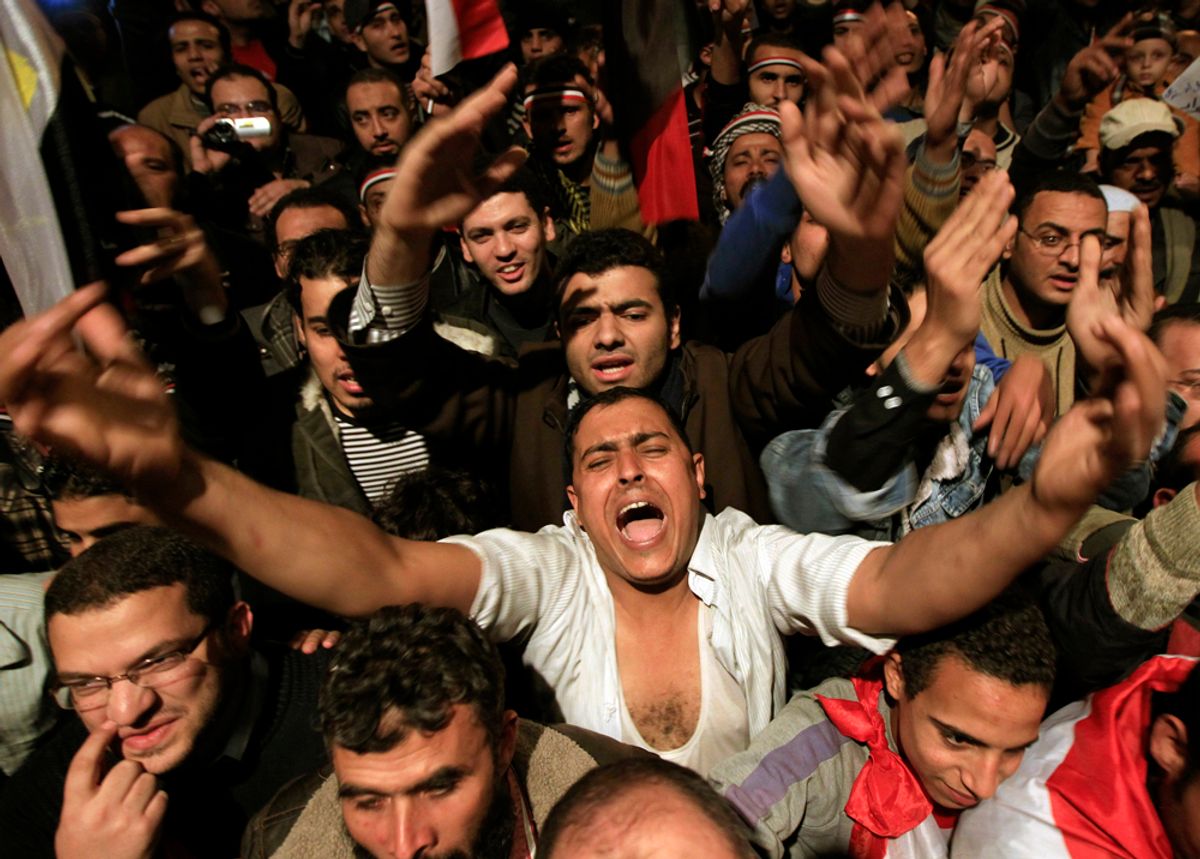 Opposition supporters shout in their stronghold of Tahrir Square, in Cairo February 10, 2011. President Hosni Mubarak provoked rage on Egypt's streets on Thursday when he said he would hand powers to his deputy but disappointed protesters who had been expecting him to step down altogether after two weeks of unrest. "Leave! Leave!" chanted thousands who had gathered in Cairo's Tahrir Square in anticipation that a televised speech would be the moment their demands for an end to Mubarak's 30 years of authoritarian, one-man rule were met.  REUTERS/Goran Tomasevic (EGYPT - Tags: POLITICS CIVIL UNREST)       (Â© Goran Tomasevic / Reuters)