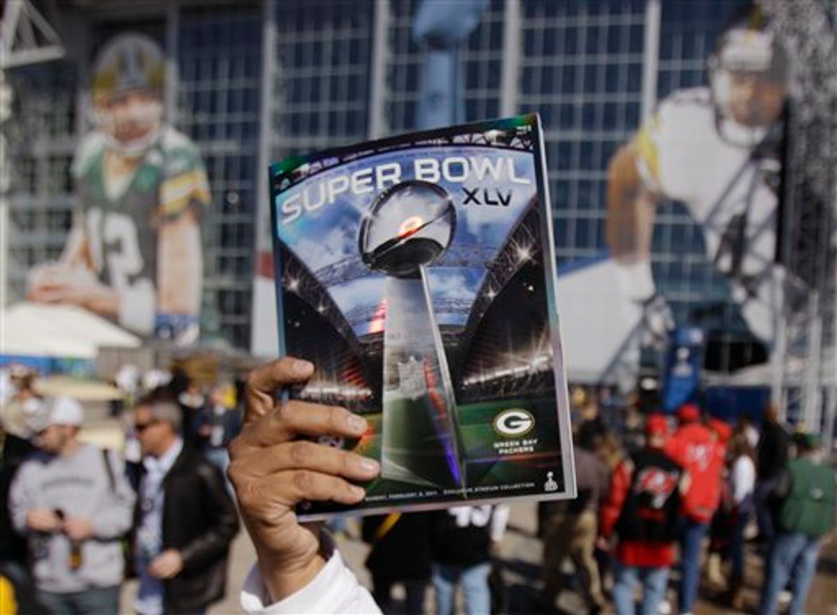 A program is sold outside Cowboy Stadium before the NFL football Super Bowl XLV game between the Green Bay Packers and the Pittsburgh Steelers Sunday, Feb. 6, 2011, in Arlington, Texas. (AP Photo/Matt Slocum)  (AP)