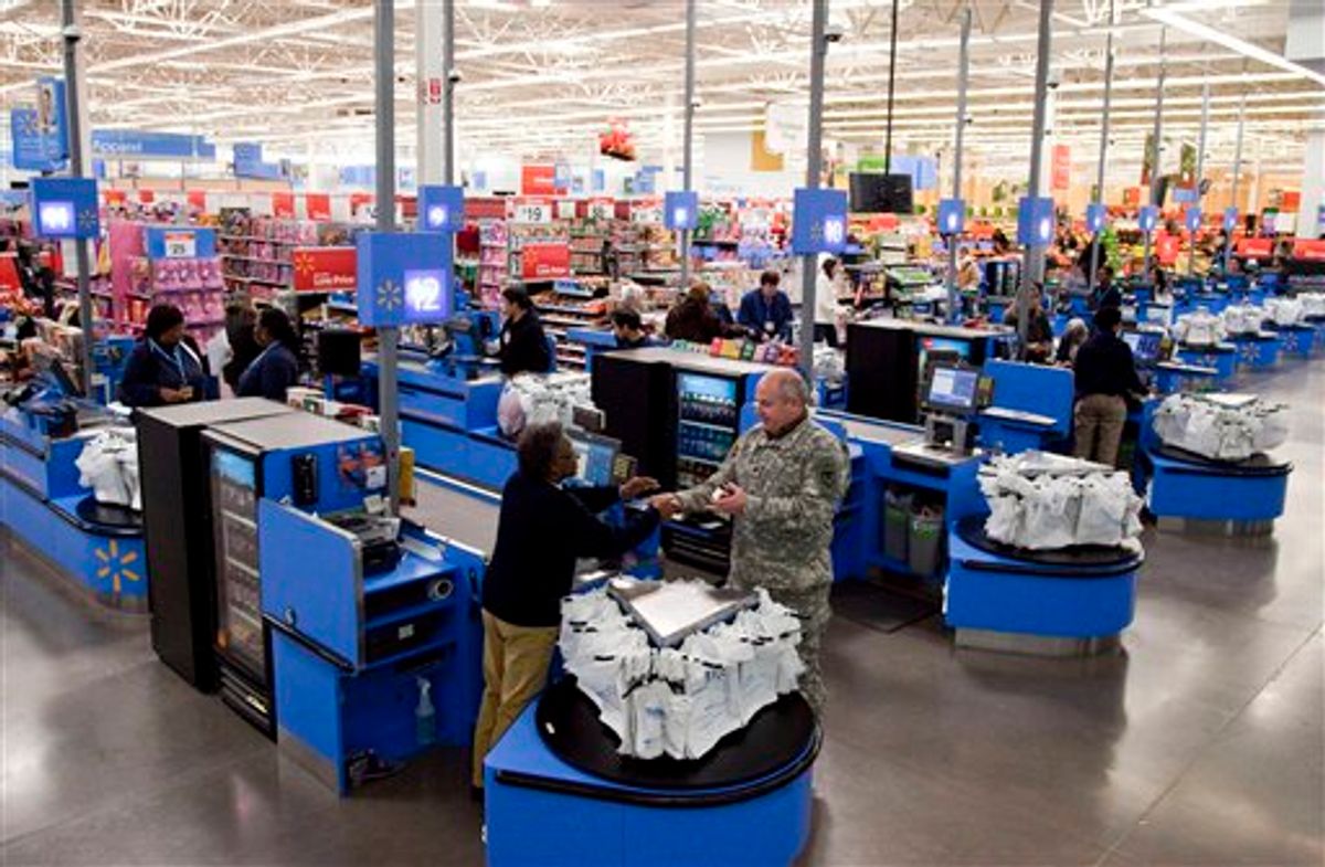 In this photo taken Dec. 15, 2010, the check-out inside a Wal-Mart store in Alexandria, Va., is shown. The battleground for the biggest fight in retailing today is being played out along this suburban highway. Going head-to-head: Wal-Mart against everyone else.  (AP Photo)  (AP)