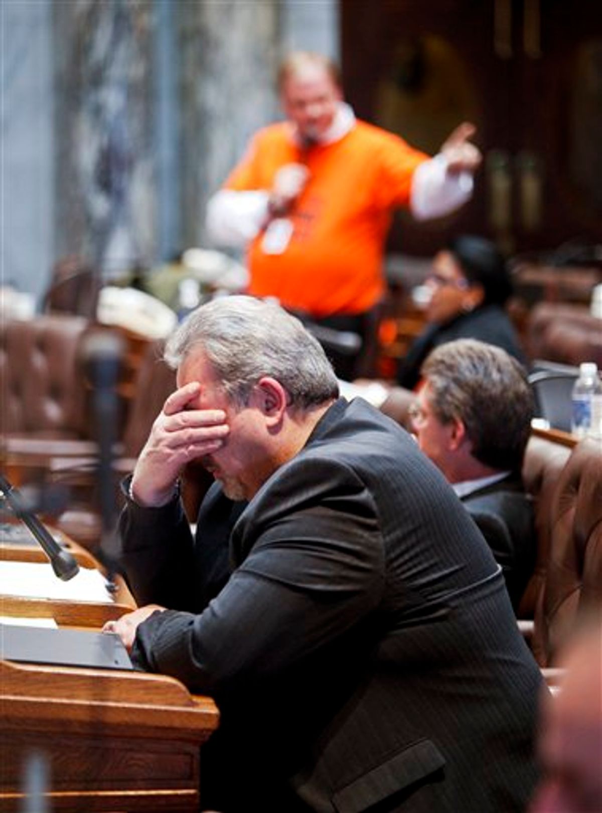 Wisconsin Rep. Mark Honadel, R-South Milwaukee, rubs his eyes during the 23rd hour of debate in the Assembly at the state Capitol in Madison, Wis., Wednesday, Feb. 23, 2011. Opponents to the governor's bill to eliminate collective bargaining rights for many state workers are on their ninth day of protests at the Capitol. (AP Photo/Andy Manis)  (AP)
