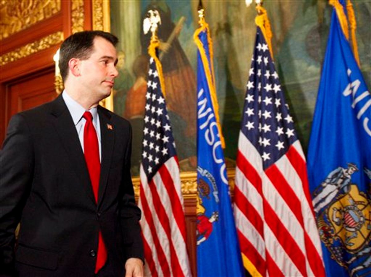 Wisconsin Gov. Scott Walker walks away after talking to the media at the state Capitol in Madison, Wis., Monday, Feb. 21, 2011. Opponents to the governor's bill to eliminate collective bargaining rights for many state workers are in the 7th day of protests at the Capitol. (AP Photo/Andy Manis) (AP)