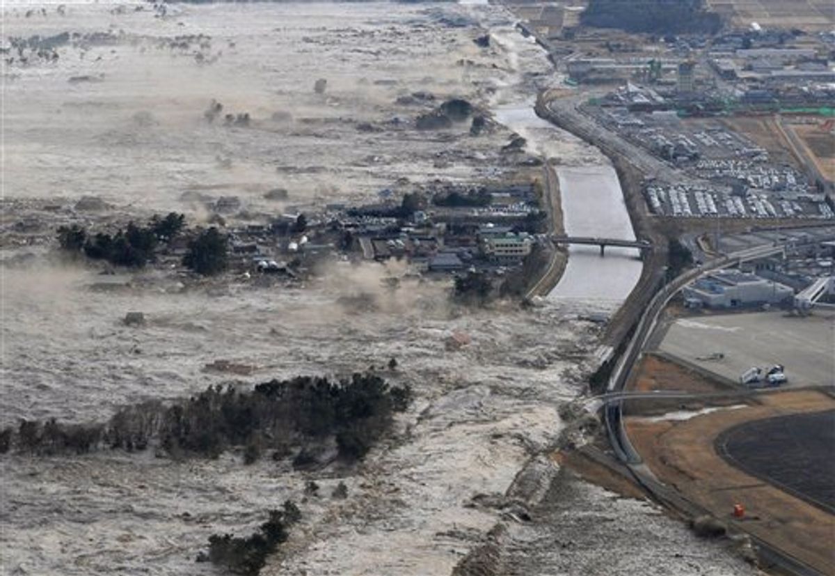 CORRECT YEAR - Earthquake-triggered tsumanis sweep shores along Iwanuma in northern Japan on Friday March 11, 2011. The magnitude 8.9 earthquake slammed Japan's eastern coast Friday, unleashing a 13-foot (4-meter) tsunami that swept boats, cars, buildings and tons of debris miles inland.  (AP Photo/Kyodo News) JAPAN OUT, MANDATORY CREDIT, FOR COMMERCIAL USE ONLY IN NORTH AMERICA (AP)