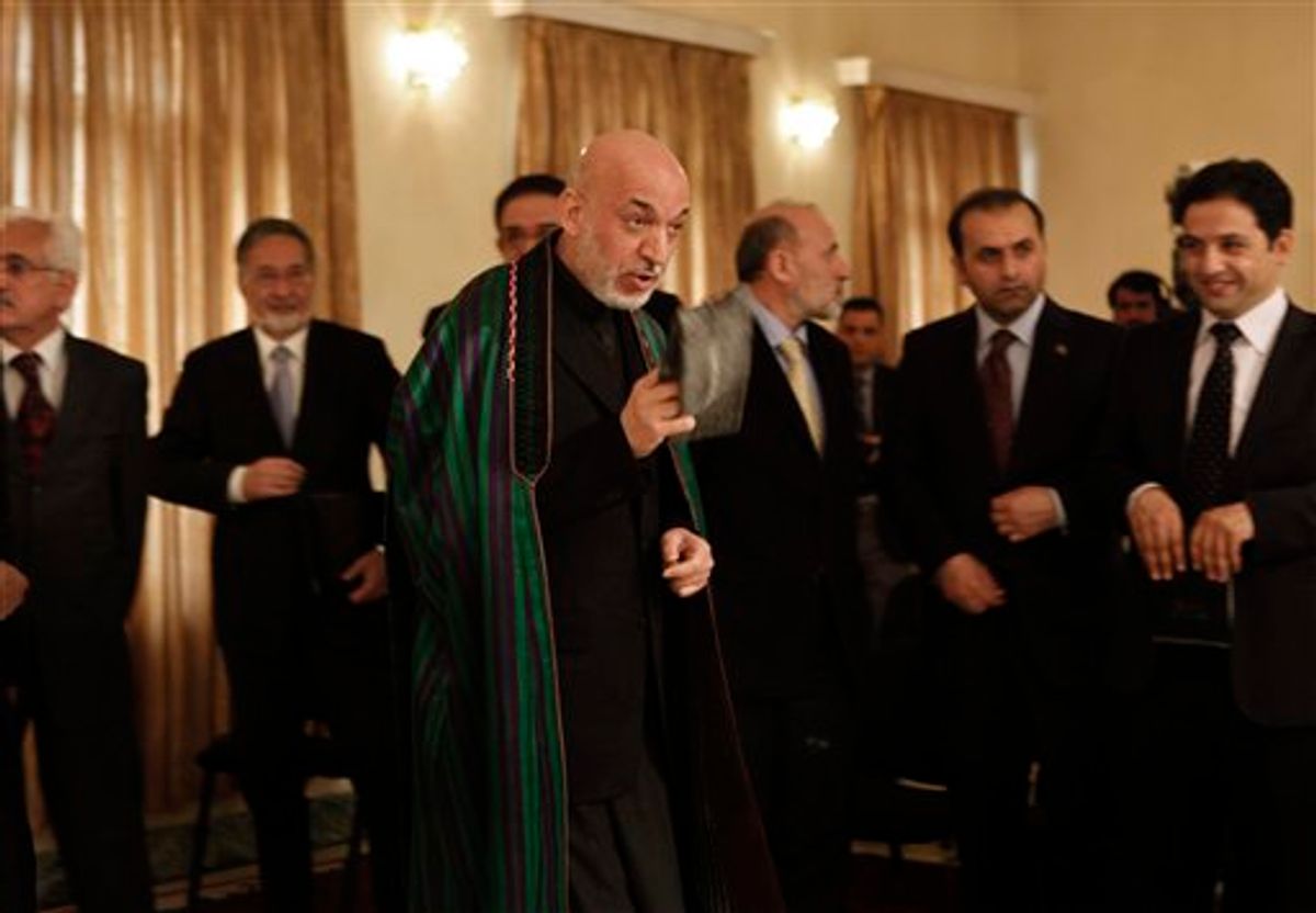 Afghan President Hamid Karzai, center, gestures towards journalists during joint press conference with Croatian counterpart Ivo Josipovic, not in picture, at The Presidential Palace in Kabul , Afghanistan, Saturday, Feb, 19, 2011. Afghanistan's president says any decision on a permanent U.S. military presence in the country must be made by Afghans and take into account the concerns of neighboring countries. (AP Photo/Dar Yasin)  (AP)
