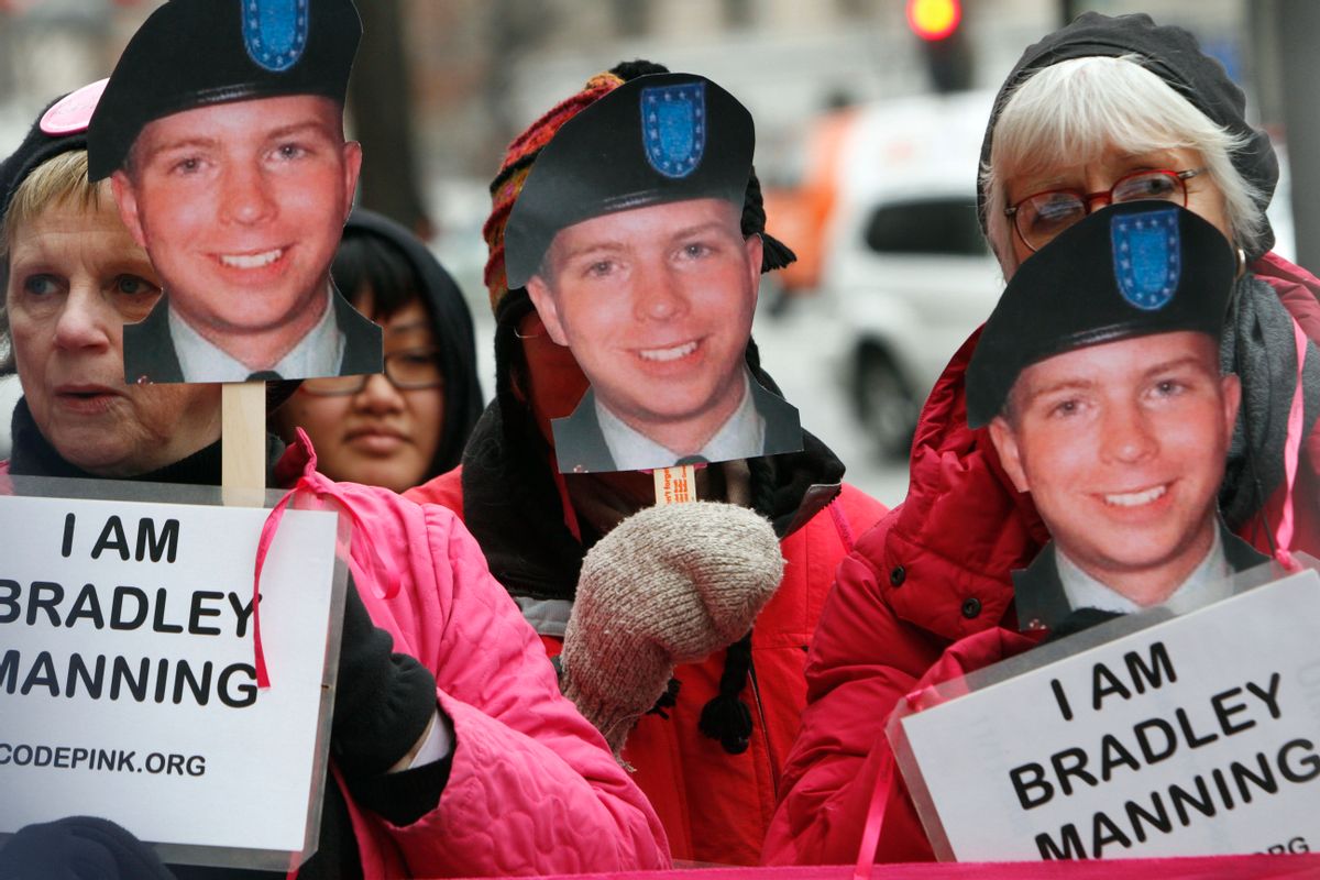 CodePink activists, including Danielle Greene, right, hold signs in support of U.S. Army Pfc. Bradley Manning, the alleged leaker of documents to WikiLeaks, who is currently jailed, Monday, Jan. 17, 2011, during a demonstration outside FBI headquarters in Washington. (AP Photo/Jacquelyn Martin) (AP)