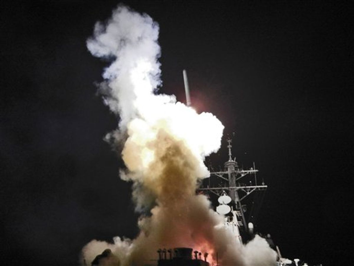 This Saturday, March 19, 2011 photo provided by the U.S. Navy shows the Arleigh Burke-class guided-missile destroyer USS Barry (DDG 52) as it launches a Tomahawk missile in support of Operation Odyssey Dawn from the Mediterranean Sea . The U.S. fired more than 100 cruise missiles from the sea while French fighter jets targeted Moammar Gadhafi's forces from the air on Saturday, launching the broadest international military effort since the Iraq war in support of an uprising that had seemed on the verge of defeat. (AP Photo/U.S. Navy, Fireman Roderick Eubanks) (AP)