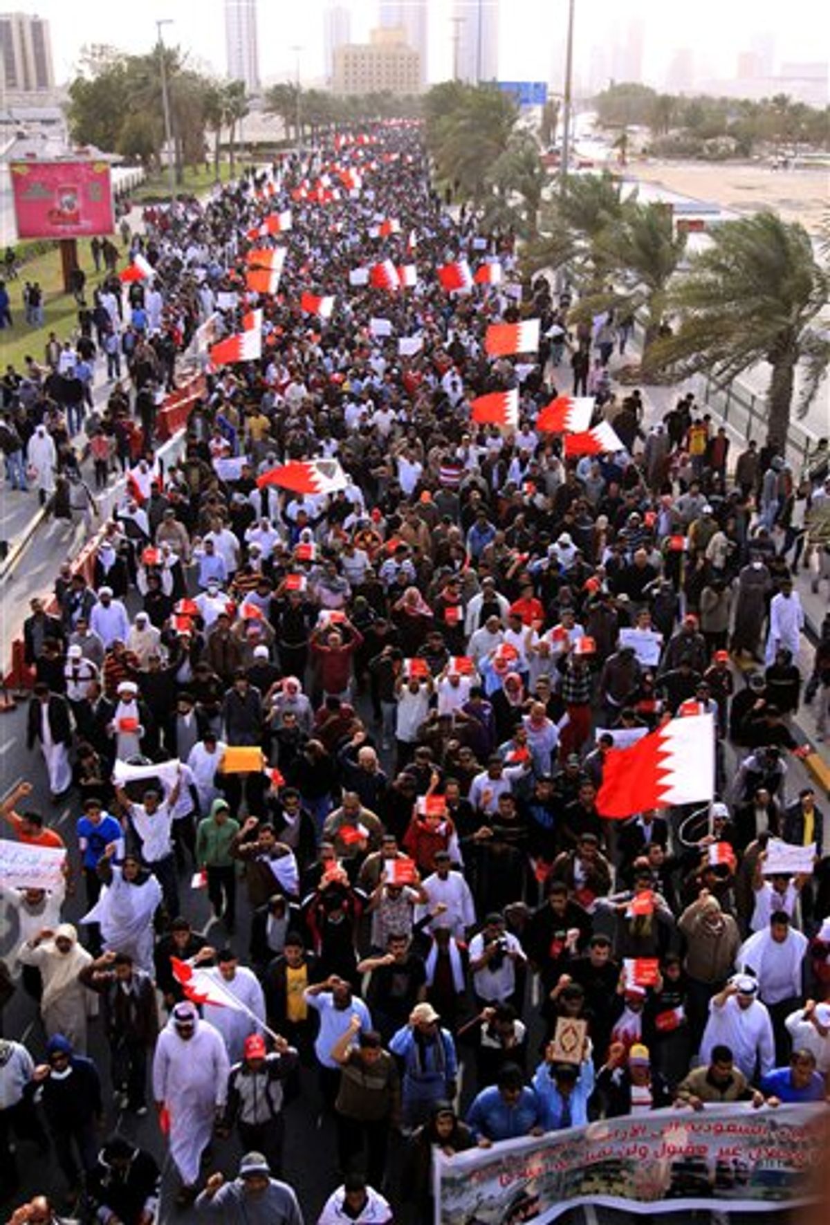 Thousands of anti-government protesters march Tuesday, March 15, 2011, to the Saudi embassy in Manama, Bahrain. Bahrain's king declared a three-month state of emergency Tuesday to quell a Shiite uprising, as clashes spread through the capital and surrounding villages in a showdown that drew in the region's major powers and splintered along its main sectarian faultlines. At least two Bahrainis and a Saudi soldier died, and hundreds of protesters were injured by shotgun blasts and clubs. (AP Photo/Hasan Jamali) (AP)